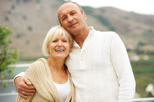 Brad & Janet near lake & mountain