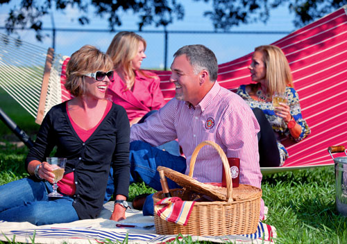 four people having a tailgate