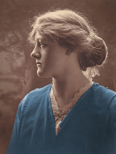 sepia-tone picture of woman looking to her right with her dress colorized to blue