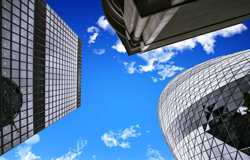 skyscrapers seen from the ground with a clear blue sky